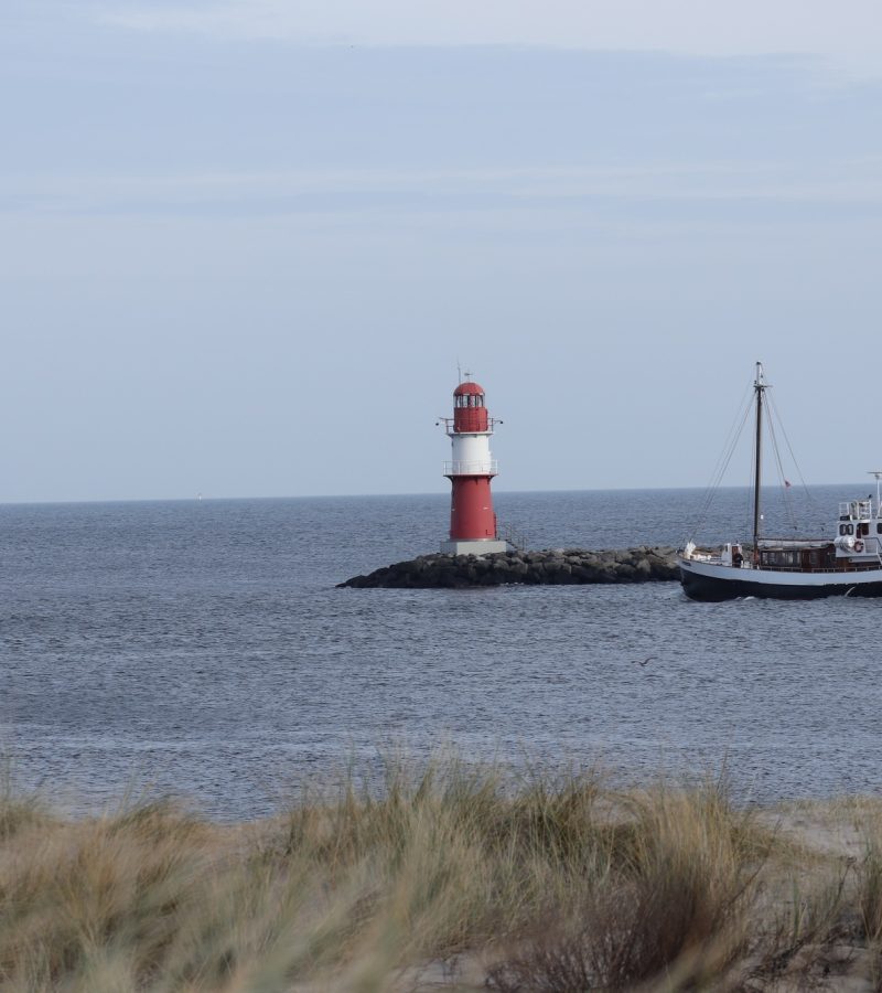 boat-near-a-lighthouse-in-the-baltic-sea-near-rostock-mecklenburg-germany.jpg boat-near-a-lighthouse-in-the-baltic-sea-near-rostock-mecklenburg-germany.jpg